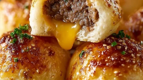 Delicious Garlic Parmesan Cheeseburger Bombs served on a plate