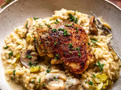 Slow Cooker Mustard Herb Chicken served with creamy orzo on a plate