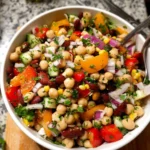 Colorful and nutritious dense bean salad with a variety of beans and vegetables