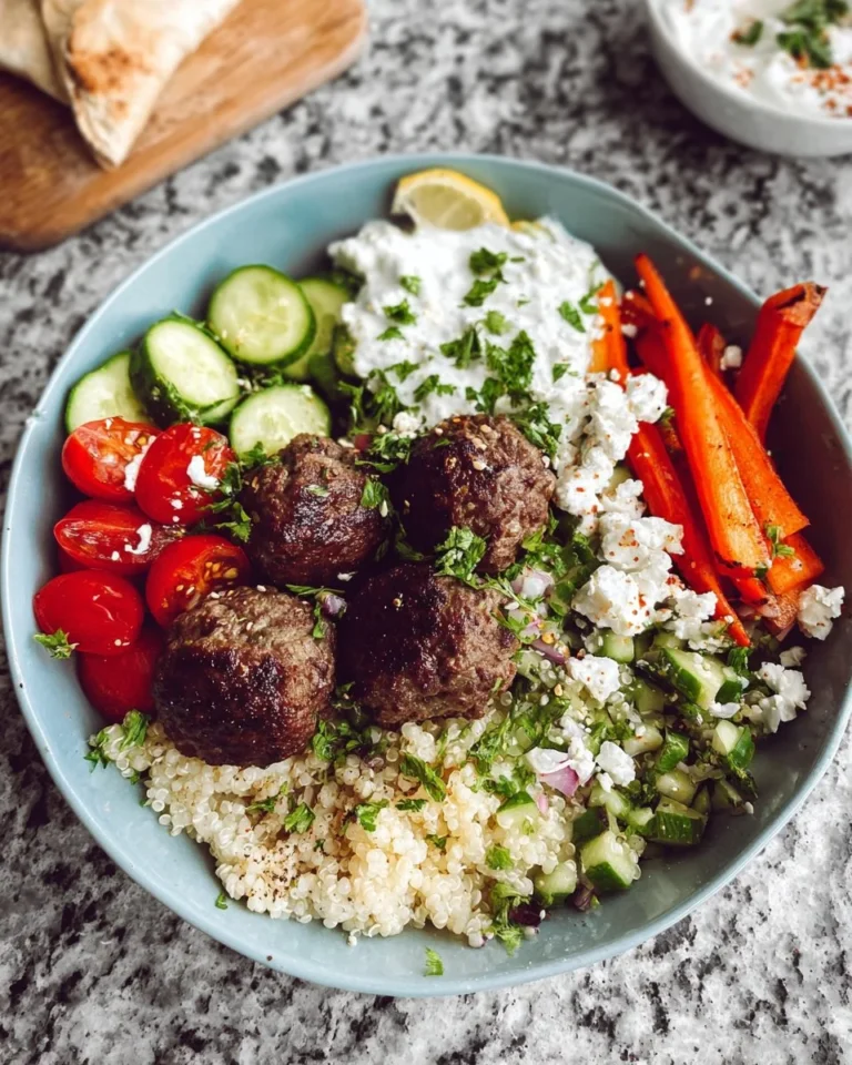 Delicious Greek meatball bowls served with fresh veggies and sauce