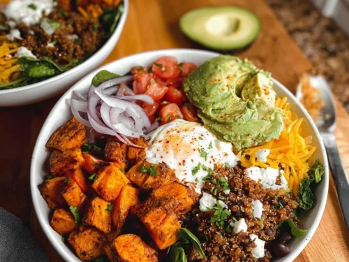 Colorful sweet potato burger bowl with fresh vegetables and toppings